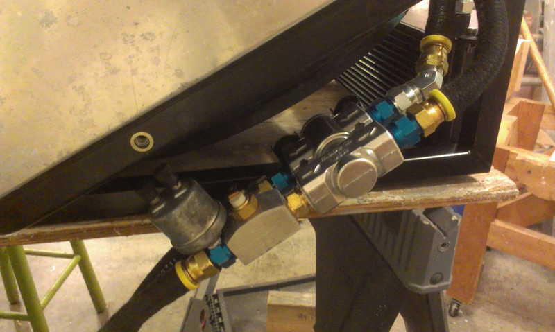 Oil cooler thermostat with temperature and pressure sensors.